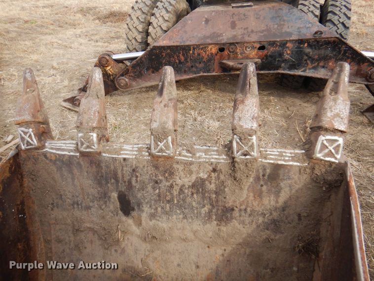 image for item DK8741 1985 Caterpillar 206  wheeled excavator