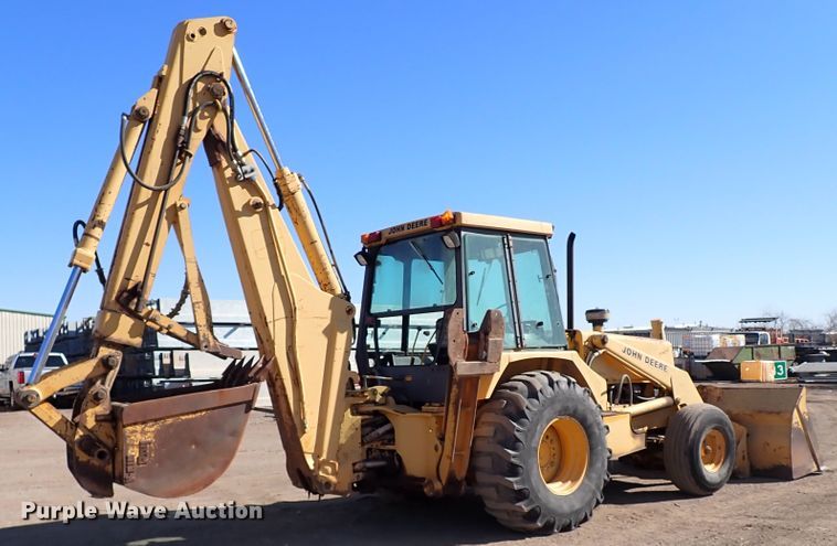 image for item IS9466 1989 John Deere 710C  backhoe