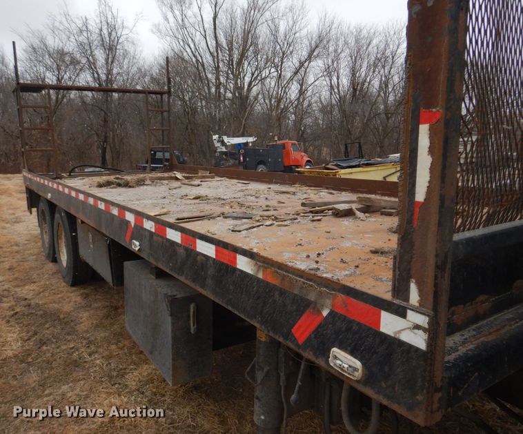 image for item IM9627 1992 Mack DM690S  flatbed truck