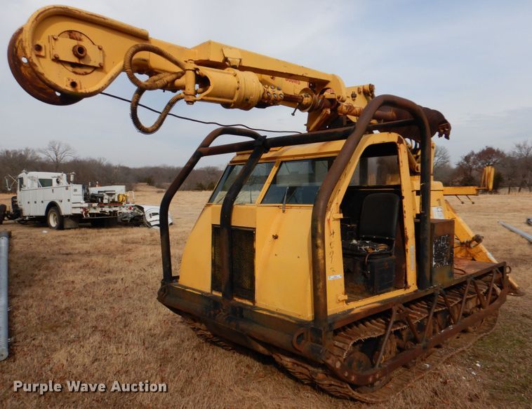image for item JS9670 Bombardier MC74  track carrier with digger derrick