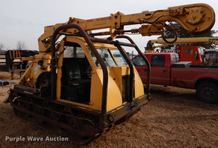 image for item JS9670 Bombardier MC74  track carrier with digger derrick