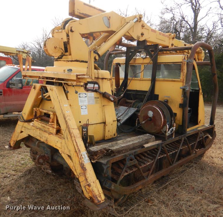 image for item JS9670 Bombardier MC74  track carrier with digger derrick
