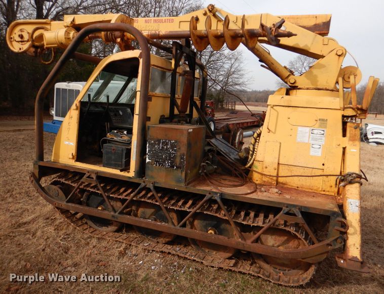 image for item JS9670 Bombardier MC74  track carrier with digger derrick