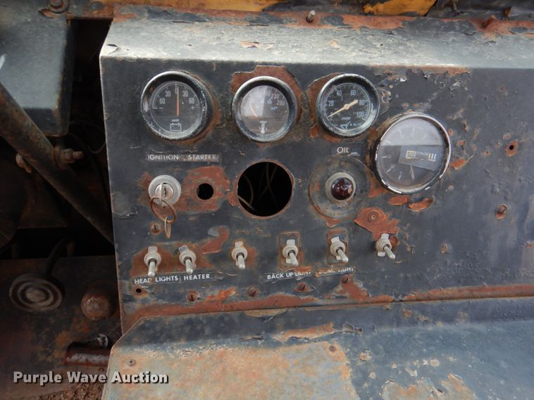 image for item JS9670 Bombardier MC74  track carrier with digger derrick