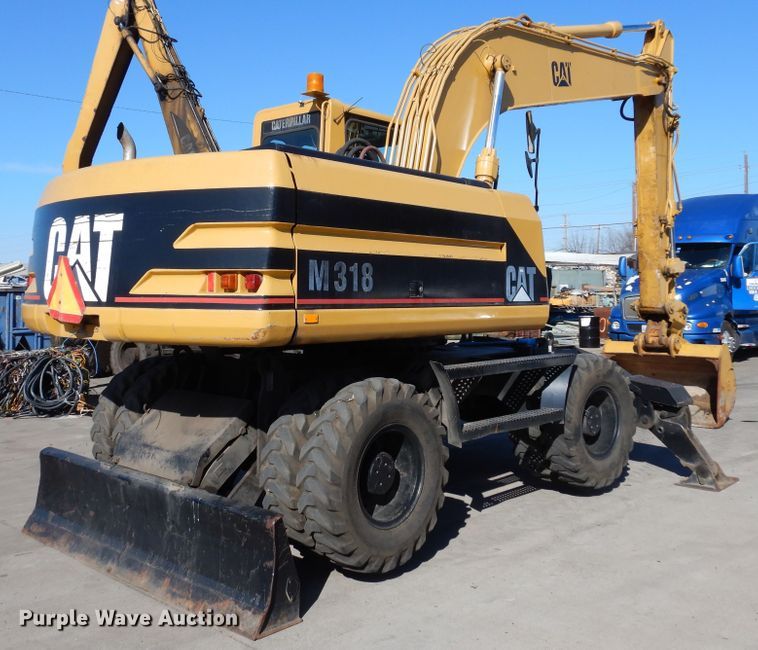 image for item DK0306 1998 Caterpillar M318  wheeled excavator