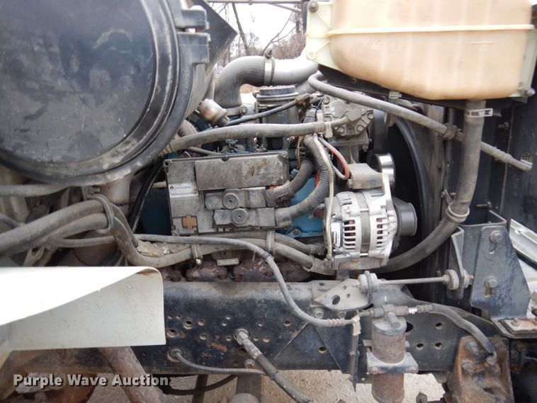 image for item IM9860 2000 International 4700  refuse truck