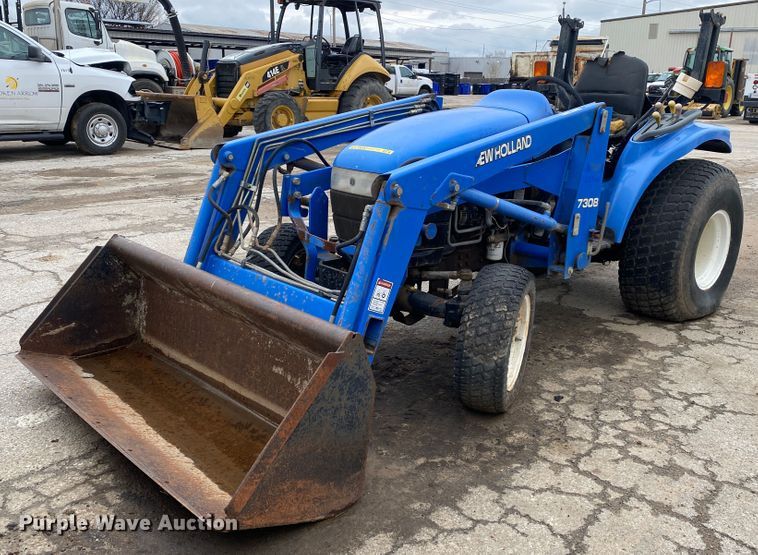 image for item JL9074 2003 New Holland TC335  MFWD tractor