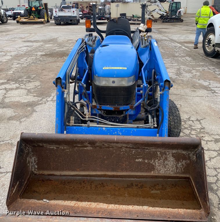 image for item JL9074 2003 New Holland TC335  MFWD tractor