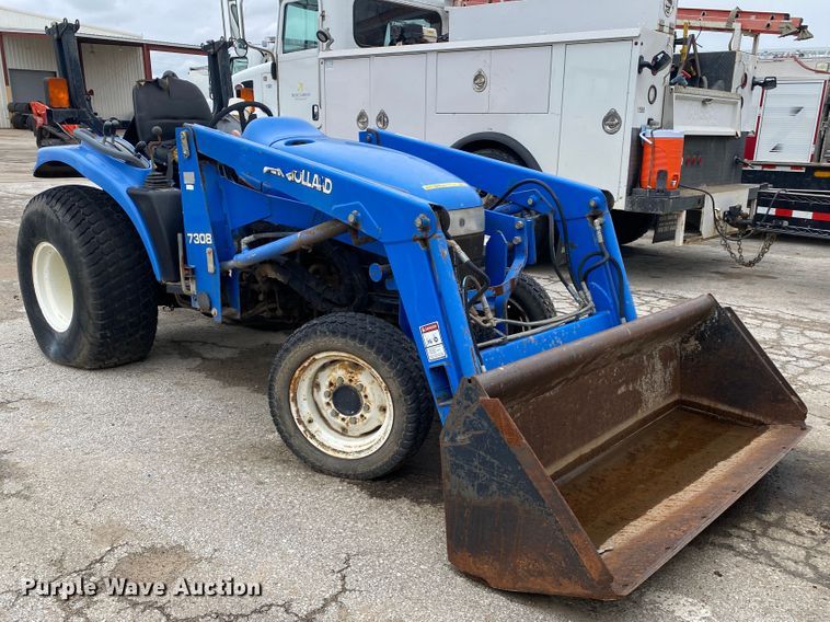 image for item JL9074 2003 New Holland TC335  MFWD tractor