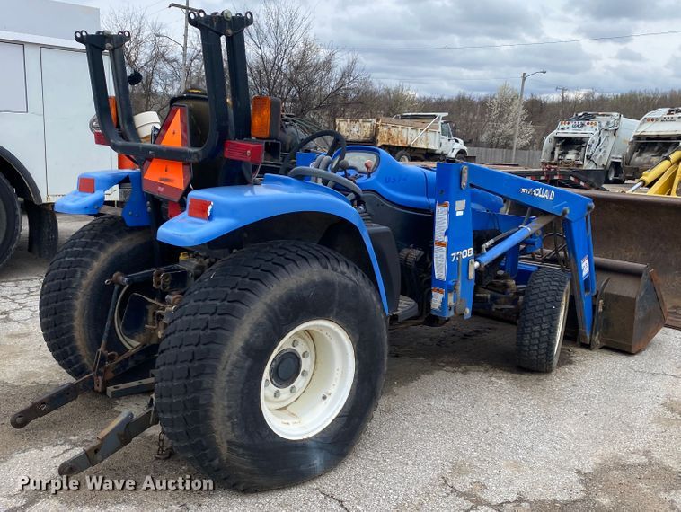 image for item JL9074 2003 New Holland TC335  MFWD tractor