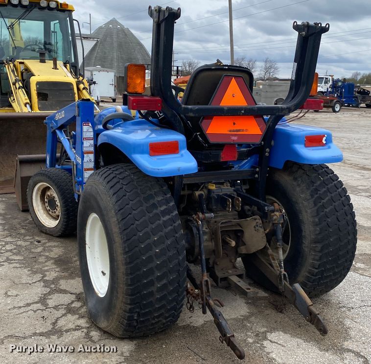 image for item JL9074 2003 New Holland TC335  MFWD tractor
