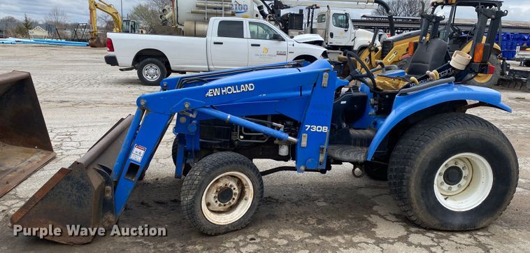 image for item JL9074 2003 New Holland TC335  MFWD tractor