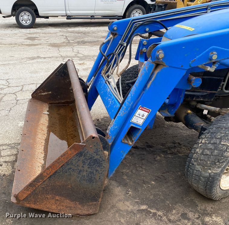 image for item JL9074 2003 New Holland TC335  MFWD tractor