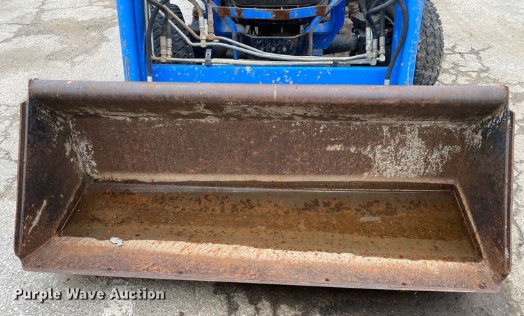 image for item JL9074 2003 New Holland TC335  MFWD tractor