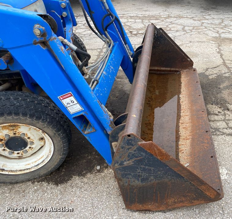 image for item JL9074 2003 New Holland TC335  MFWD tractor