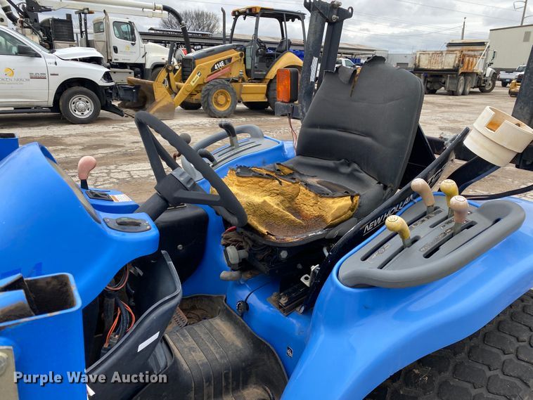 image for item JL9074 2003 New Holland TC335  MFWD tractor