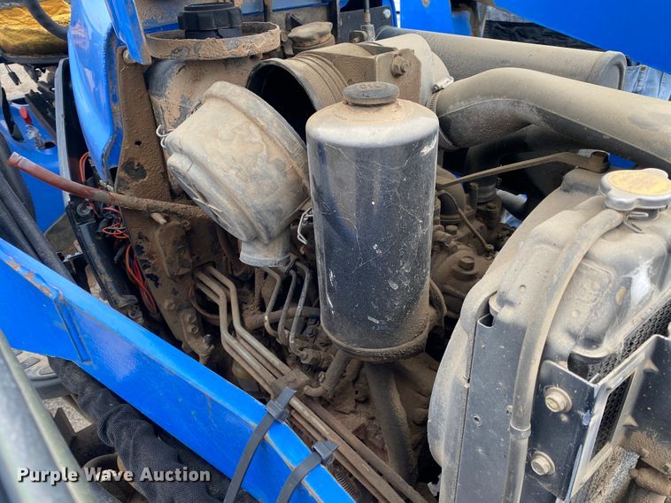 image for item JL9074 2003 New Holland TC335  MFWD tractor