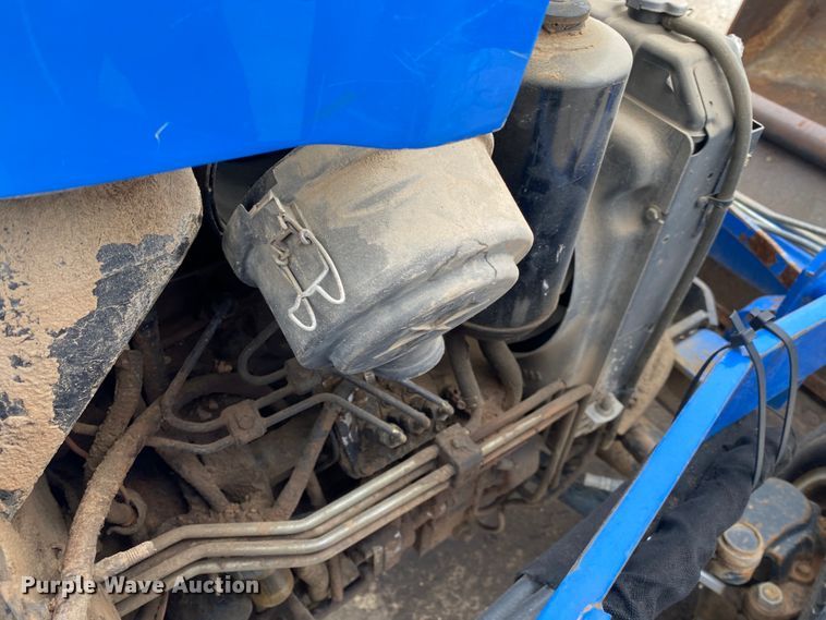 image for item JL9074 2003 New Holland TC335  MFWD tractor