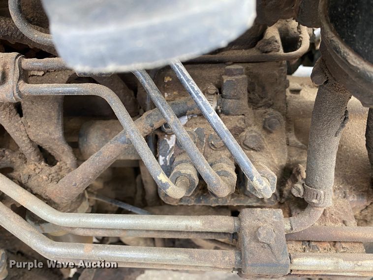 image for item JL9074 2003 New Holland TC335  MFWD tractor