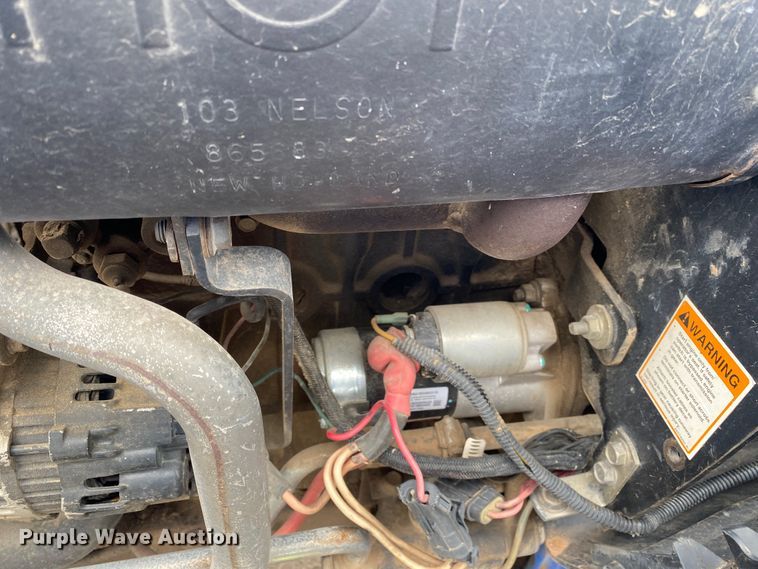 image for item JL9074 2003 New Holland TC335  MFWD tractor