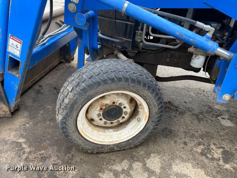 image for item JL9074 2003 New Holland TC335  MFWD tractor