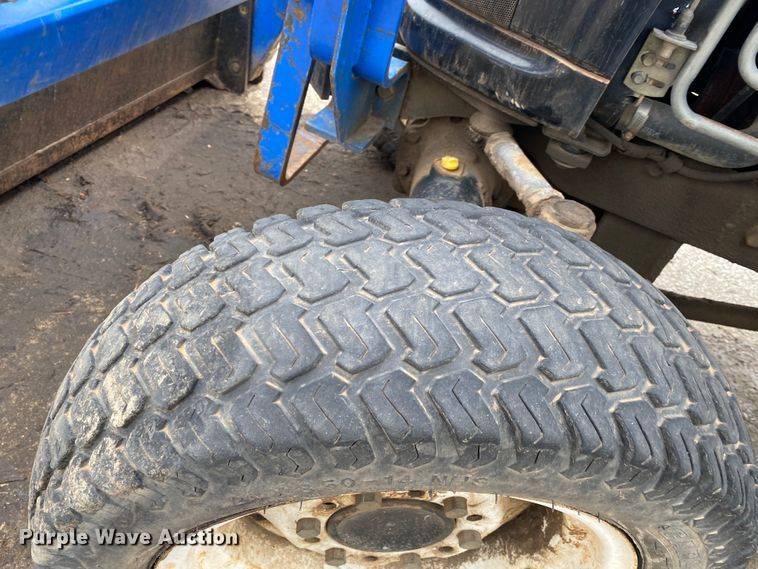 image for item JL9074 2003 New Holland TC335  MFWD tractor