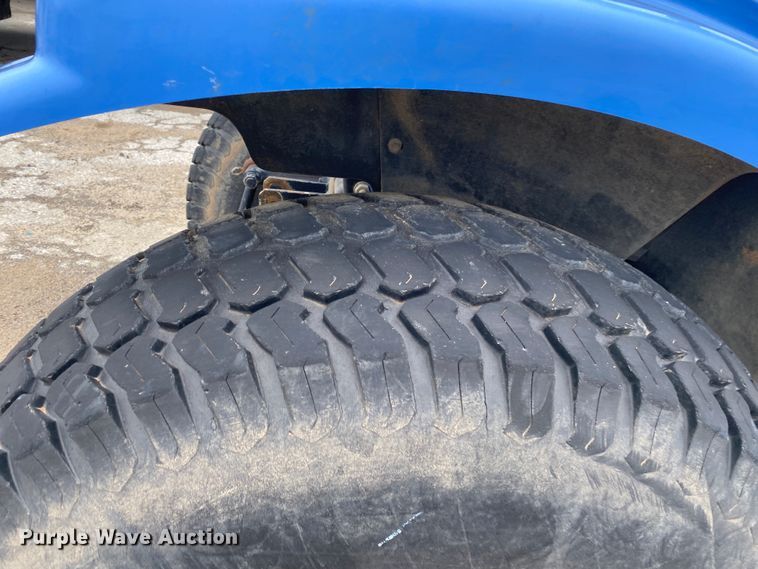 image for item JL9074 2003 New Holland TC335  MFWD tractor