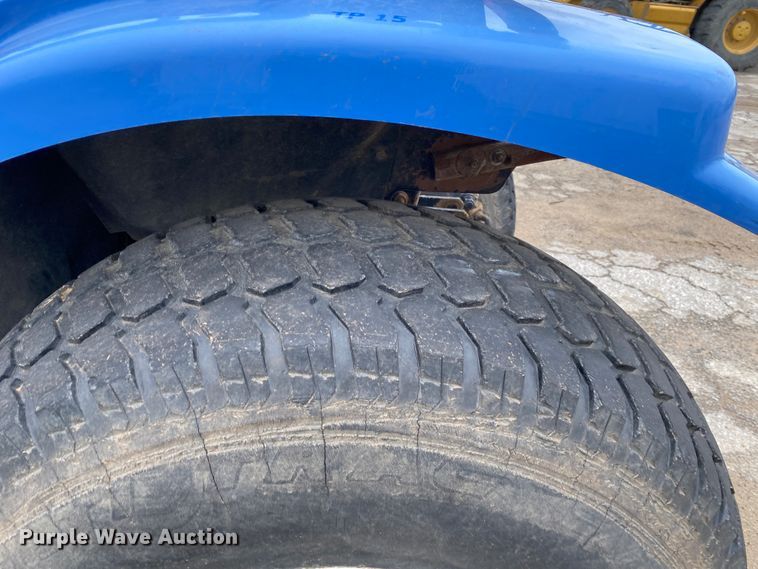 image for item JL9074 2003 New Holland TC335  MFWD tractor