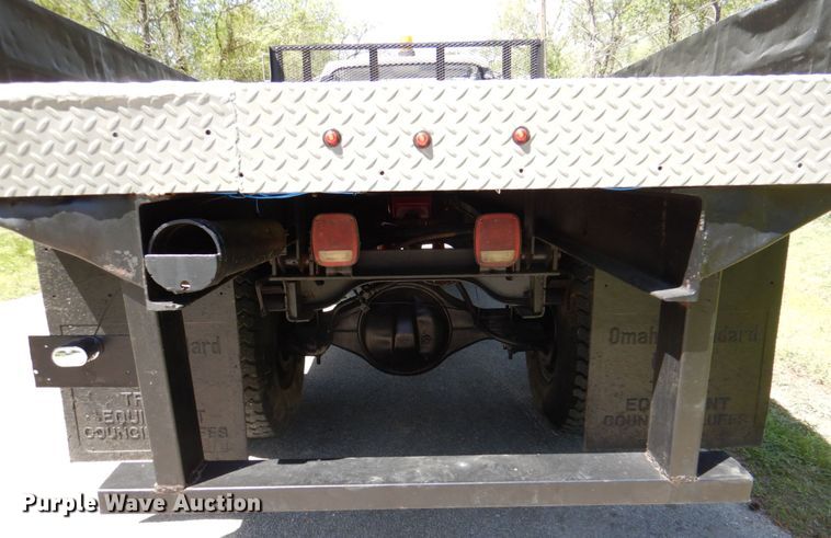 image for item DP3922 1985 Ford F700  dump flatbed truck