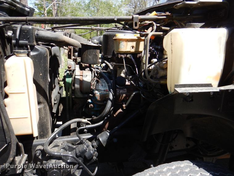 image for item DP3922 1985 Ford F700  dump flatbed truck