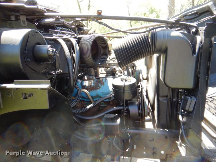 image for item DP3922 1985 Ford F700  dump flatbed truck