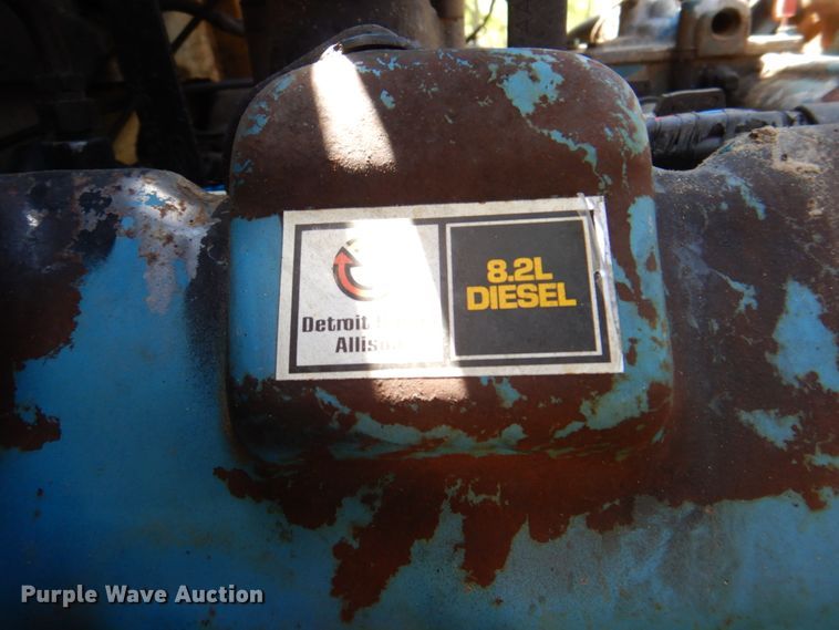 image for item DP3922 1985 Ford F700  dump flatbed truck