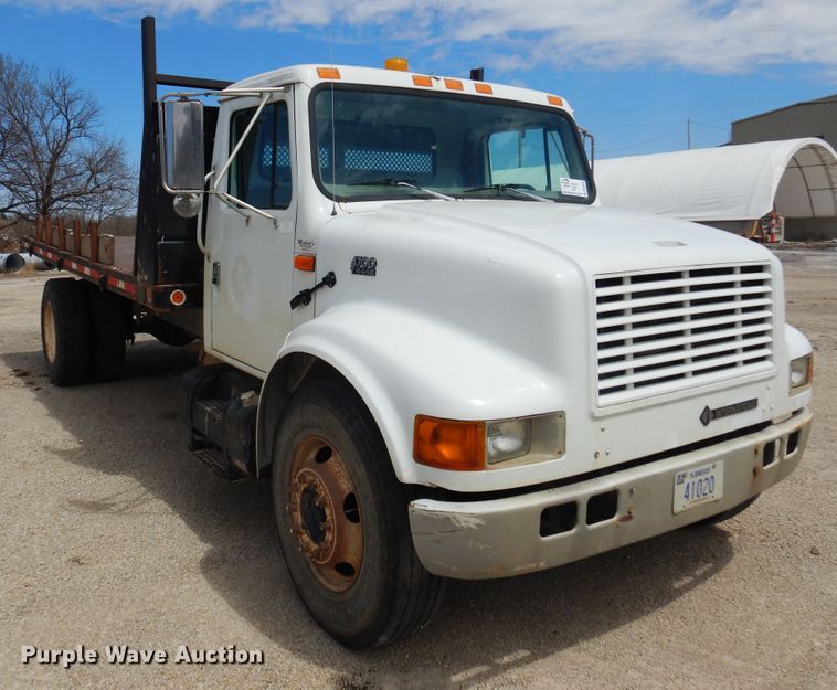 image for item DK0833 2000 International 4700  dump flatbed truck