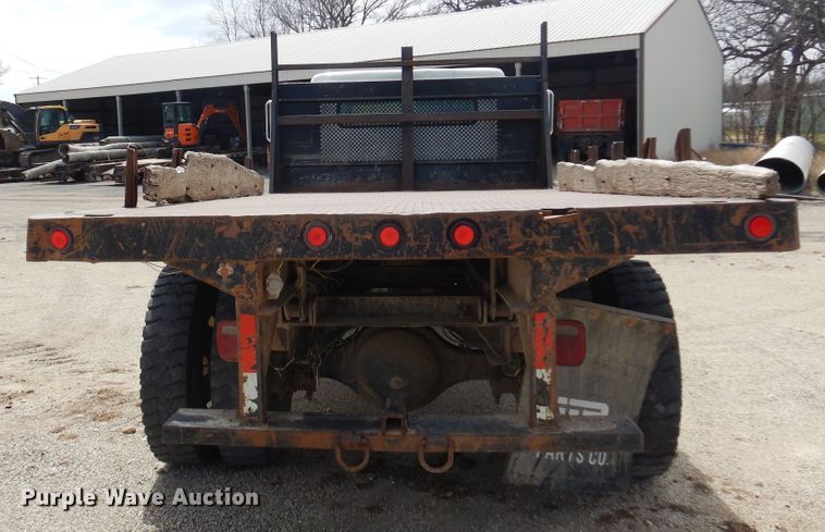 image for item DK0833 2000 International 4700  dump flatbed truck