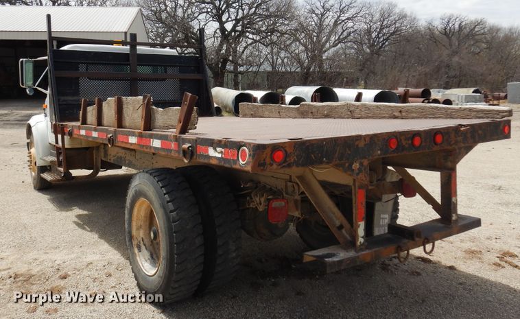 image for item DK0833 2000 International 4700  dump flatbed truck