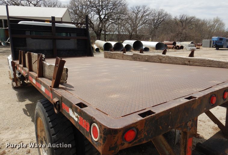 image for item DK0833 2000 International 4700  dump flatbed truck