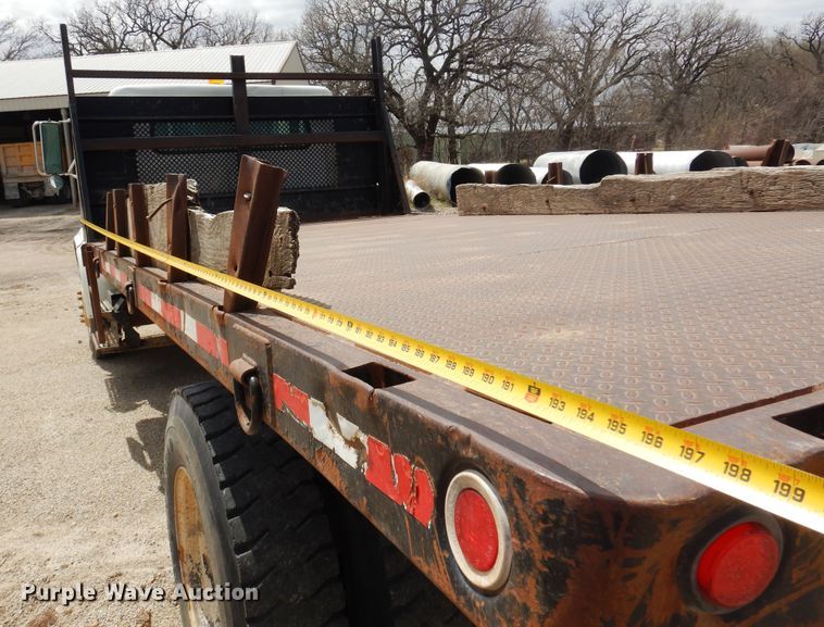 image for item DK0833 2000 International 4700  dump flatbed truck