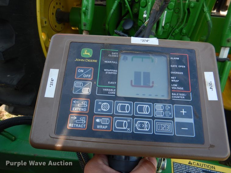 image for item JR9571 2014 John Deere 569  round baler