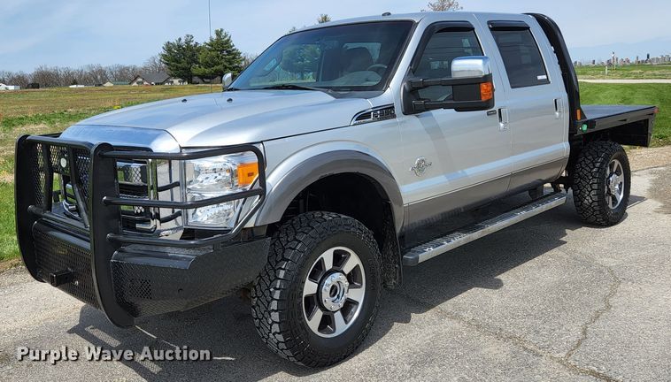 image for item KE9781 2011 Ford F350 Super Duty Lariat  Crew Cab flatbed pickup truck