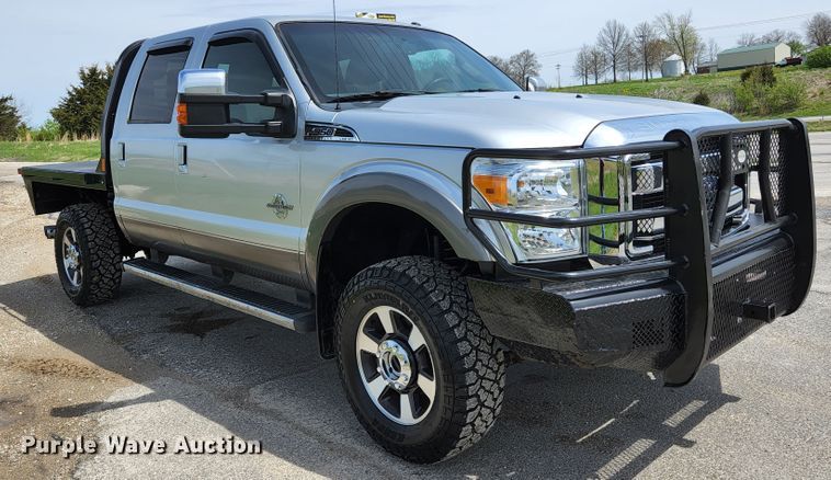 image for item KE9781 2011 Ford F350 Super Duty Lariat  Crew Cab flatbed pickup truck