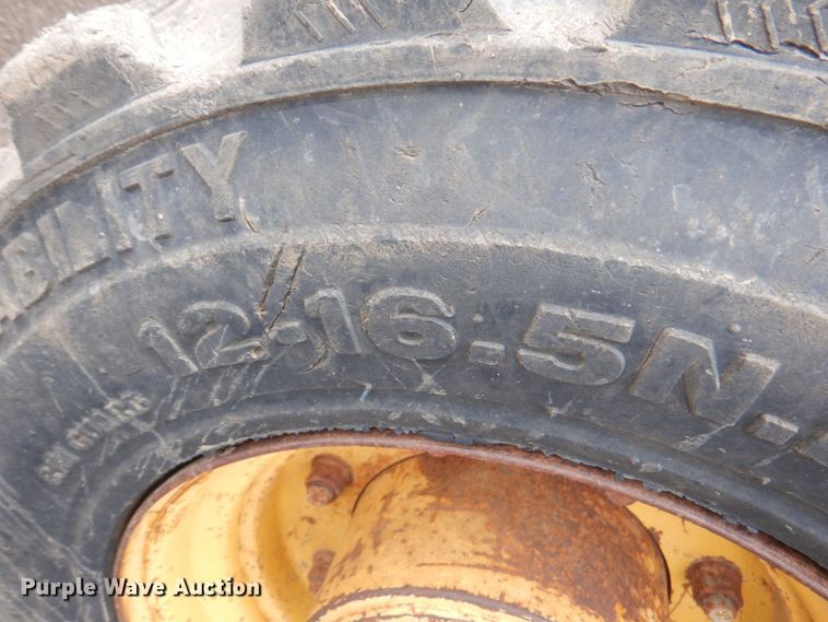 image for item DM6147 1998 John Deere 310E  backhoe