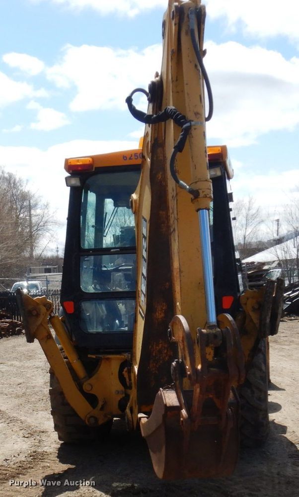 image for item MF9565 John Deere 310E  backhoe