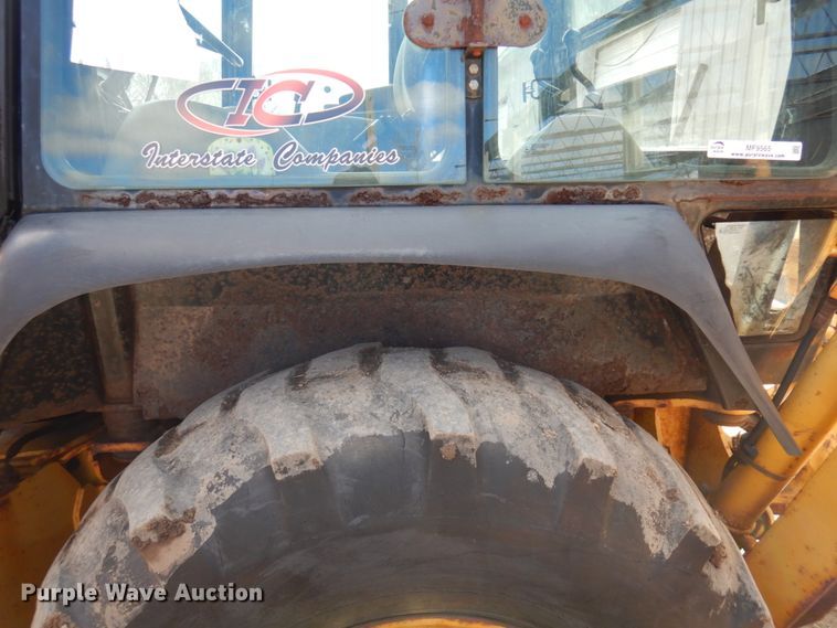 image for item MF9565 John Deere 310E  backhoe