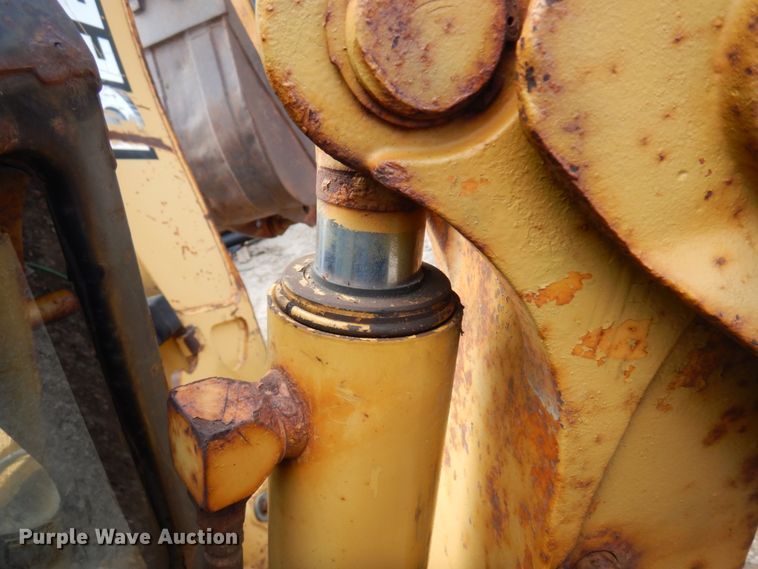 image for item MF9565 John Deere 310E  backhoe