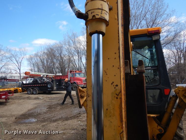 image for item MF9565 John Deere 310E  backhoe