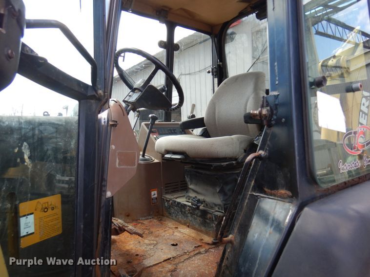 image for item MF9565 John Deere 310E  backhoe