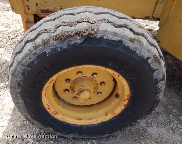 image for item MF9565 John Deere 310E  backhoe