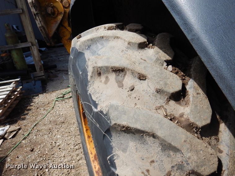 image for item MF9565 John Deere 310E  backhoe