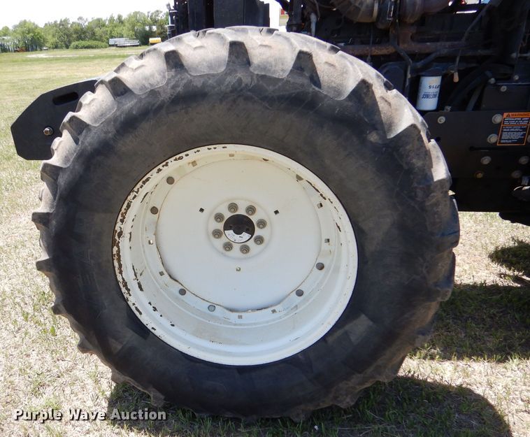 image for item LS9185 2002 New Holland TV140  4WD bi-directional tractor