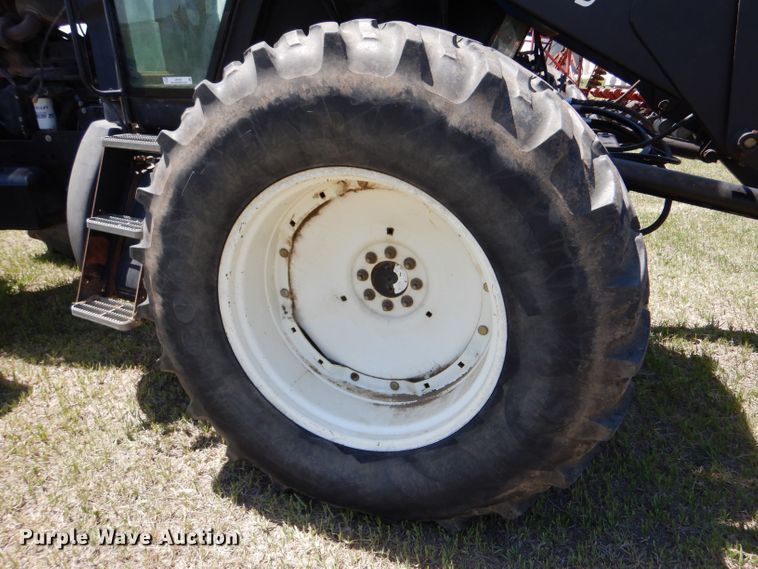 image for item LS9185 2002 New Holland TV140  4WD bi-directional tractor